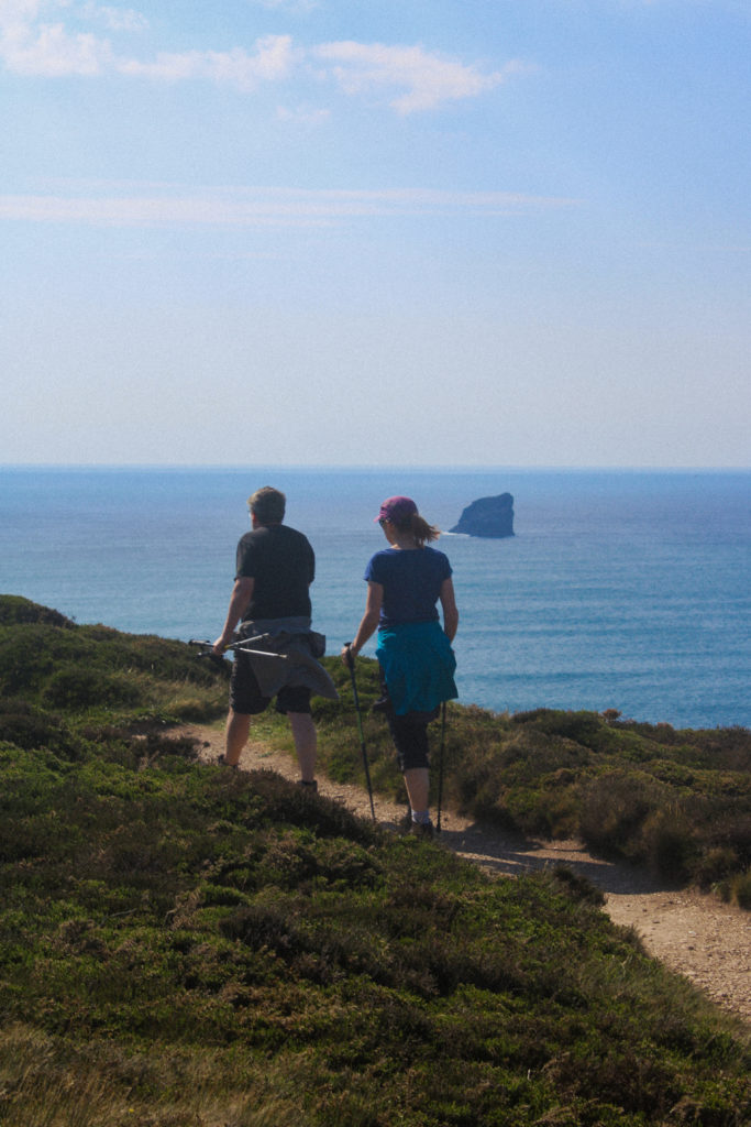 A photograph of walkers on the South West Coast Path, above St Agnes in Cornwall