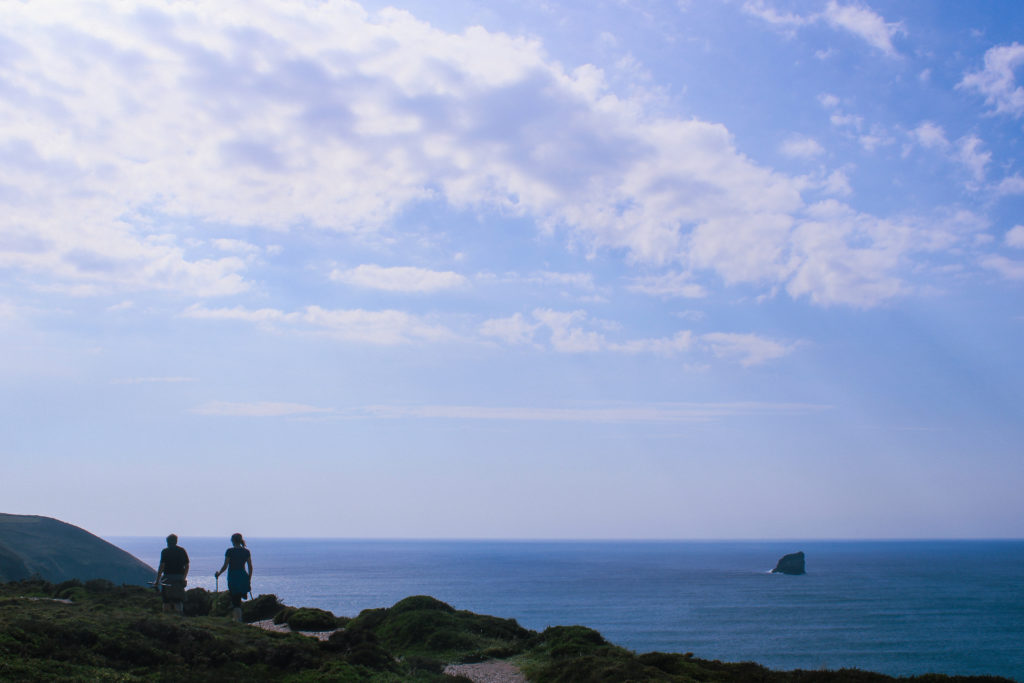 A photograph of walkers, walking the South West Coast Path in St Agnes